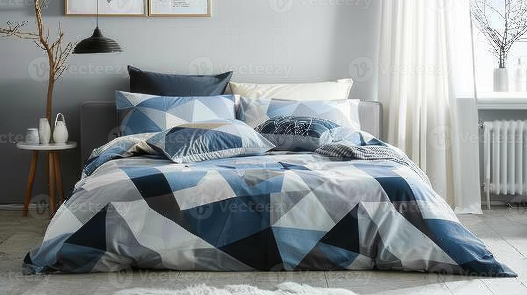 A bed with a blue and white striped comforter and pillows photo