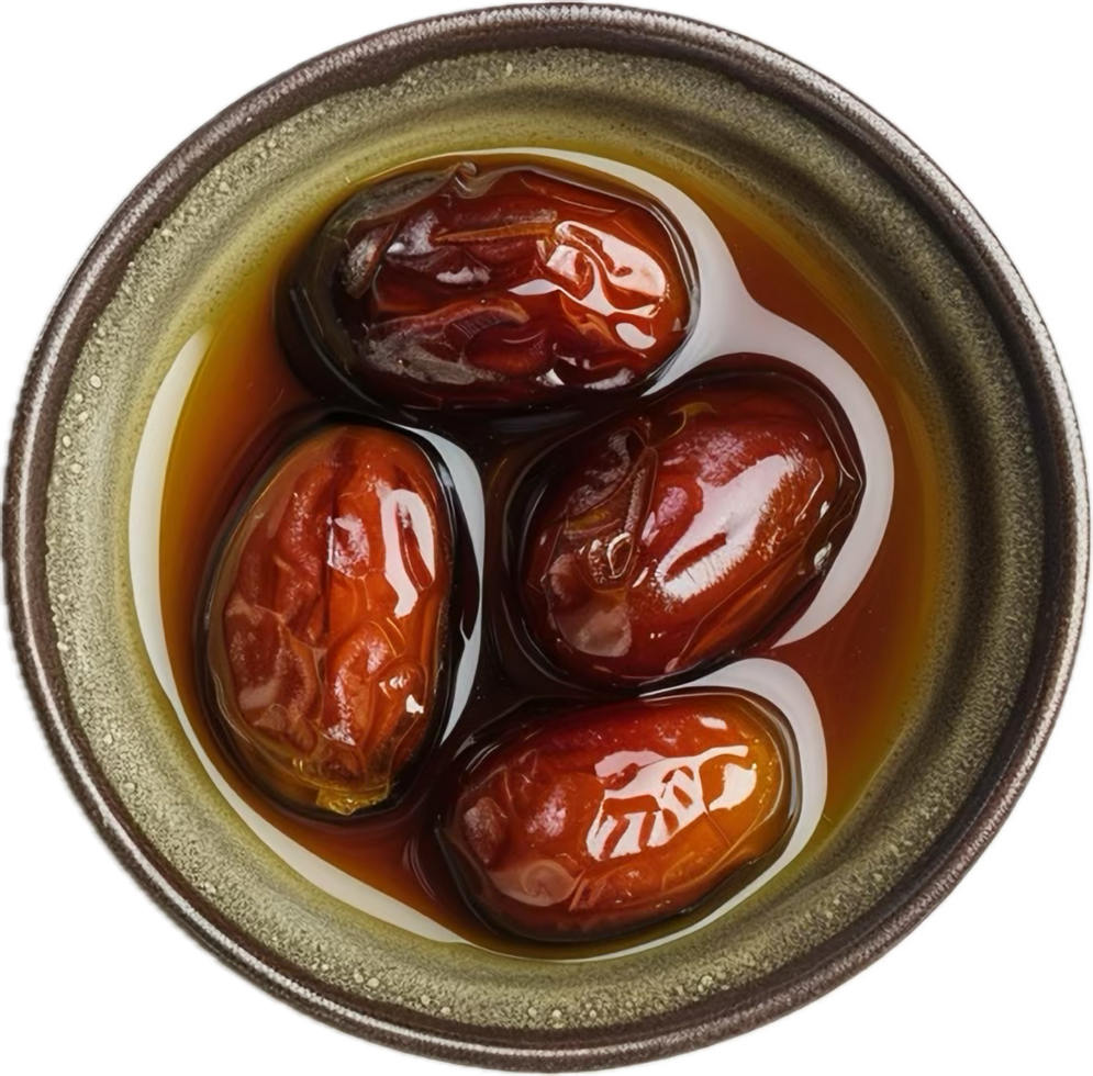 Sweet dates in syrup bowl top view. png