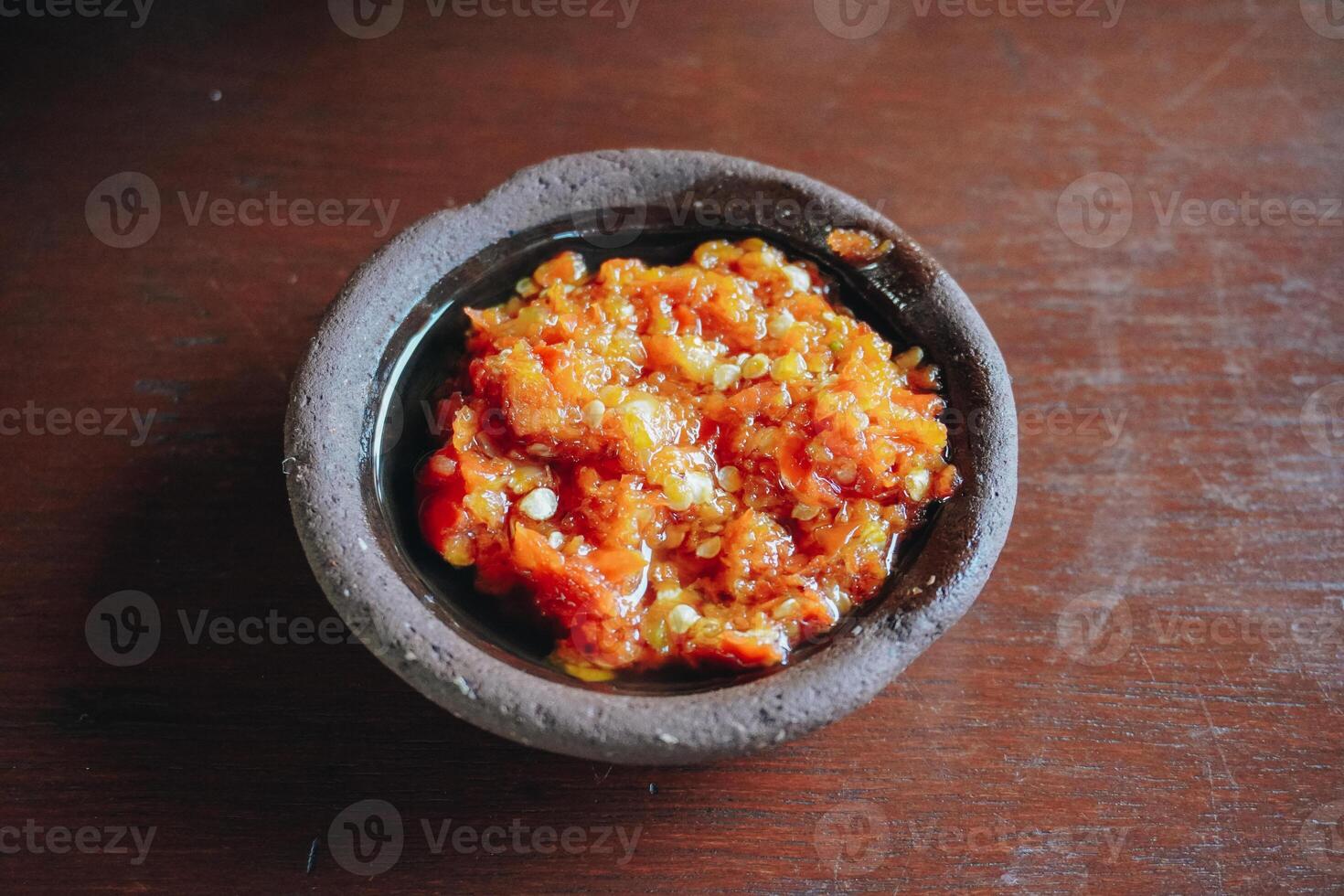 Sambal Bawang or traditional Indonesian spicy onion sauce made with ingredients onion, red chilies, garlic, and salt. photo