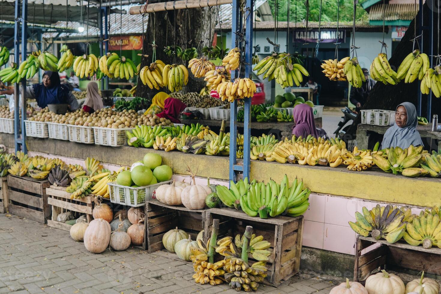 Vibrant street market stall brimming with fresh and colorful fruits neatly displayed. photo