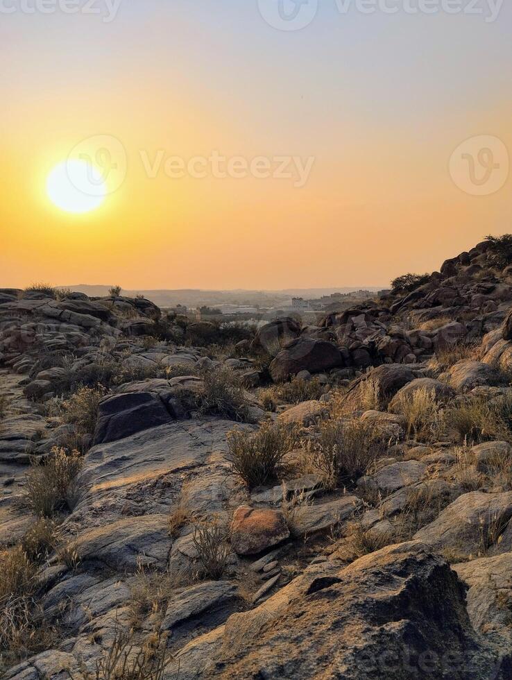 the sun sets over the desert in the namib desert photo