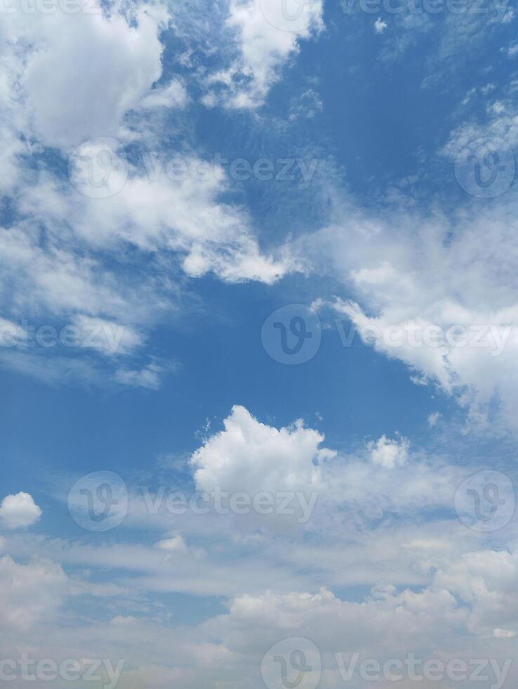 a person flying a kite in the sky photo