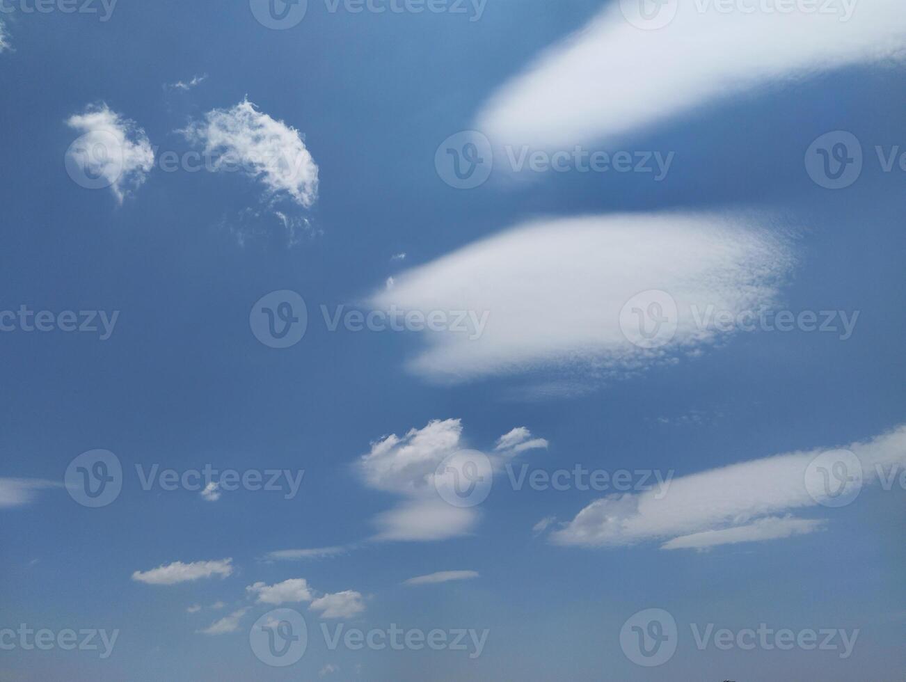 a view of the sky with clouds and a few clouds photo