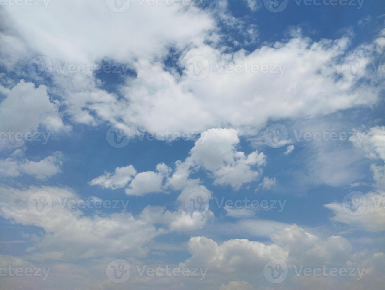 a blue sky with clouds and a few white clouds photo