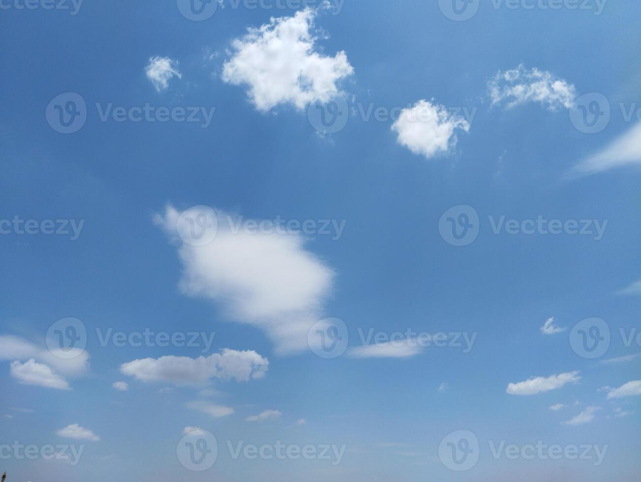 a view of the sky with clouds and a few clouds photo