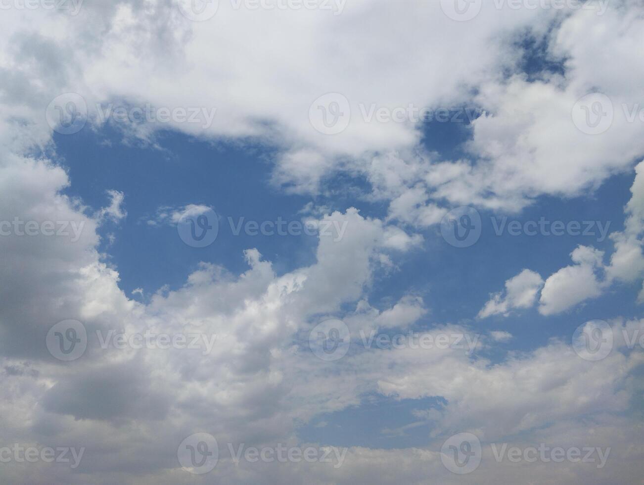 a view of the sky with clouds and a blue sky photo