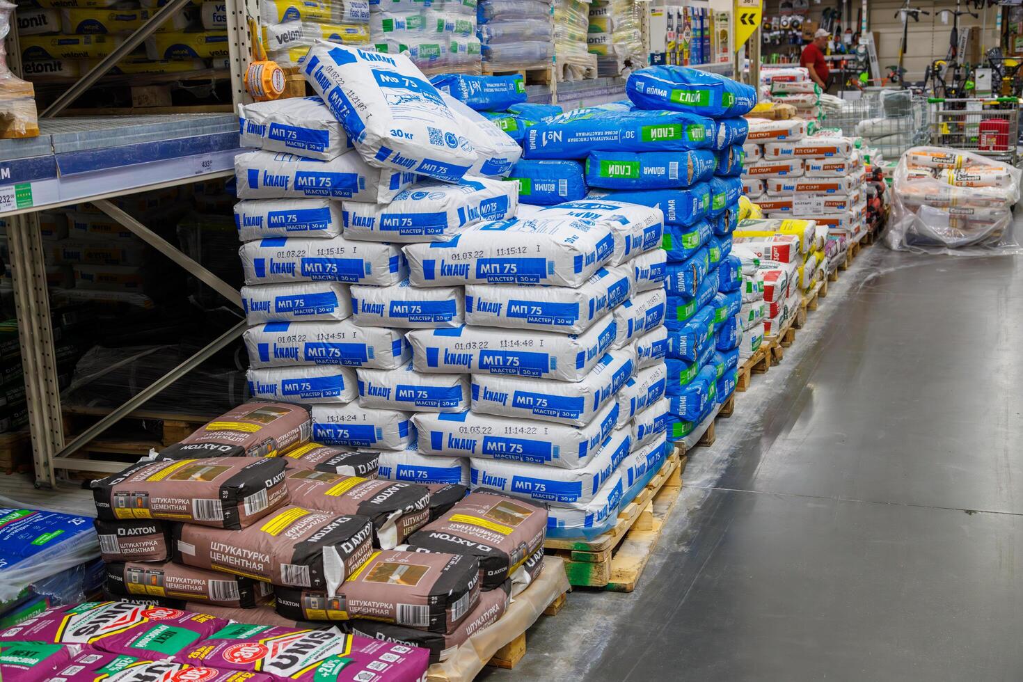 Pallets of gypsum plaster in a hardware store photo