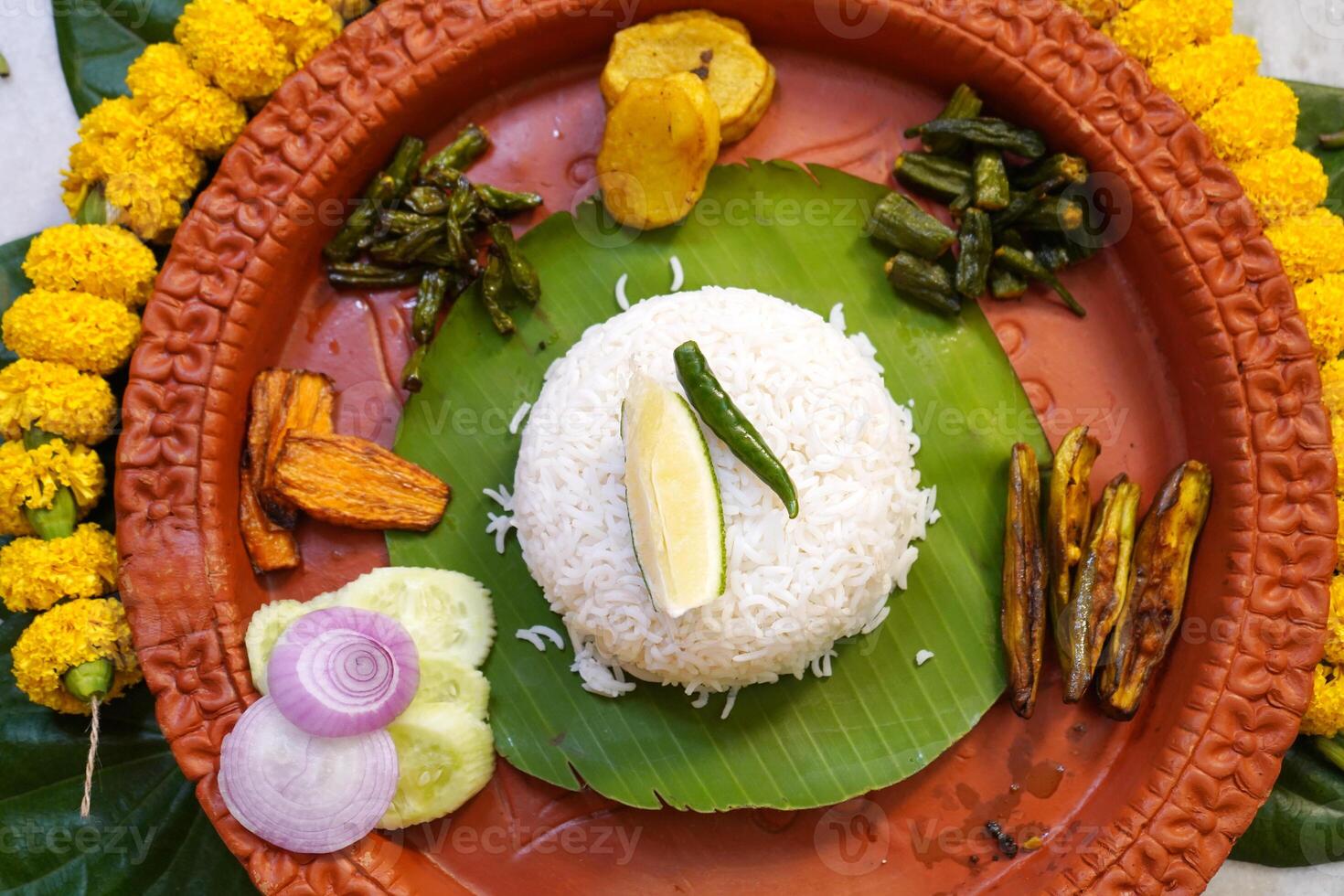 Bengali Cuisine served in earthenware during Jamaisasti Occasion photo