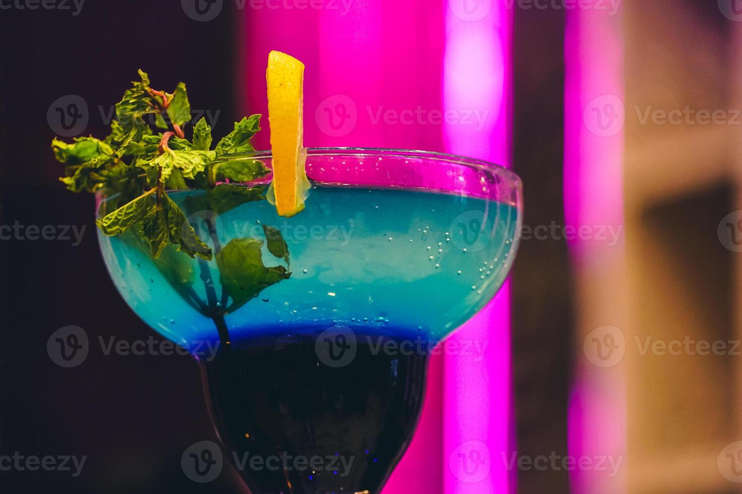 Summer alcoholic cocktails. lemon slice on glass, colorful background, hard light, top view photo