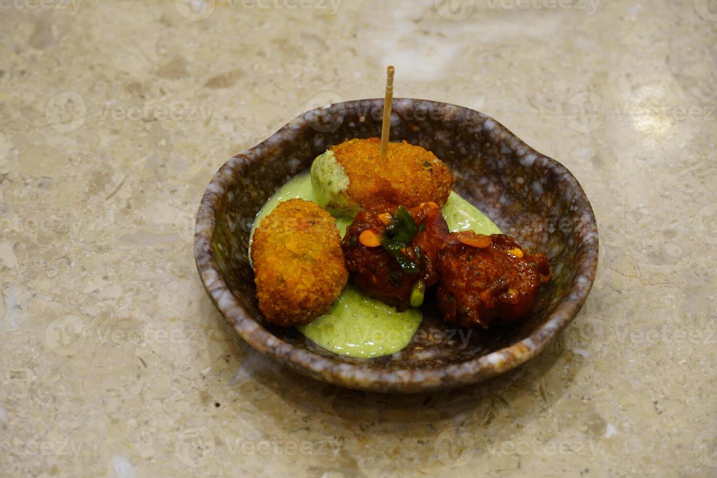 Pakore Is Made Of Moong Dal, Yellow Mung Lentils, Chana Daal with red and green sauce photo