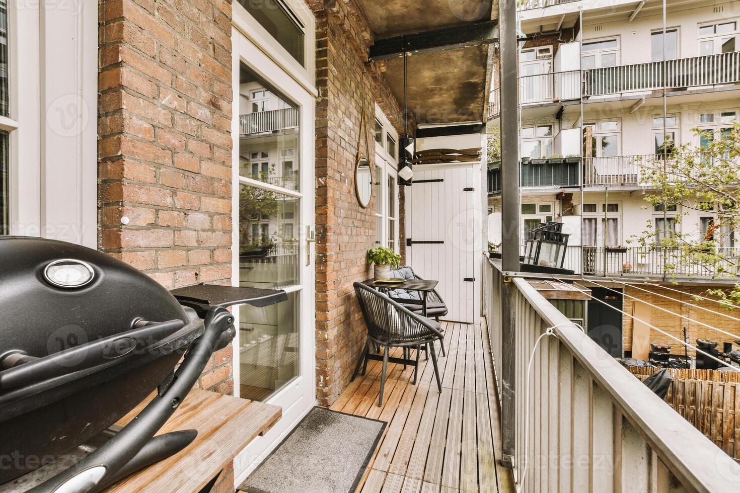 A balcony with a grill photo
