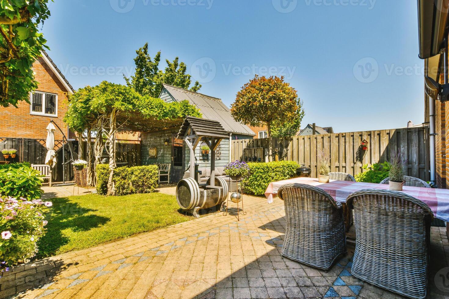 A patio with a table and chairs photo