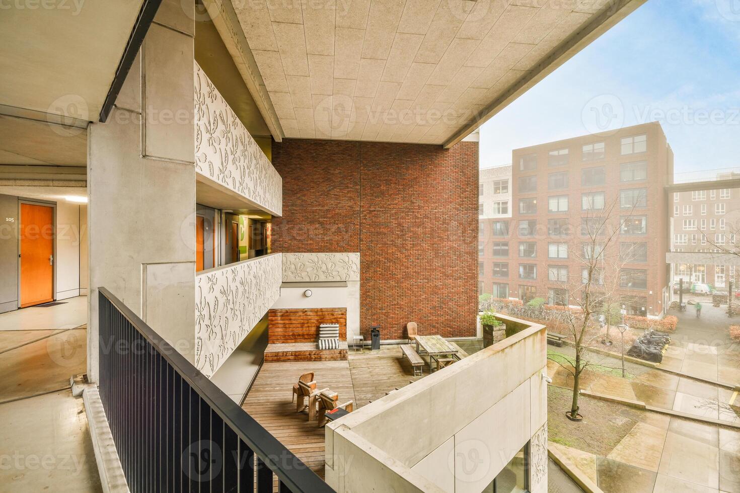 A view of the courtyard from the balcony of a building photo