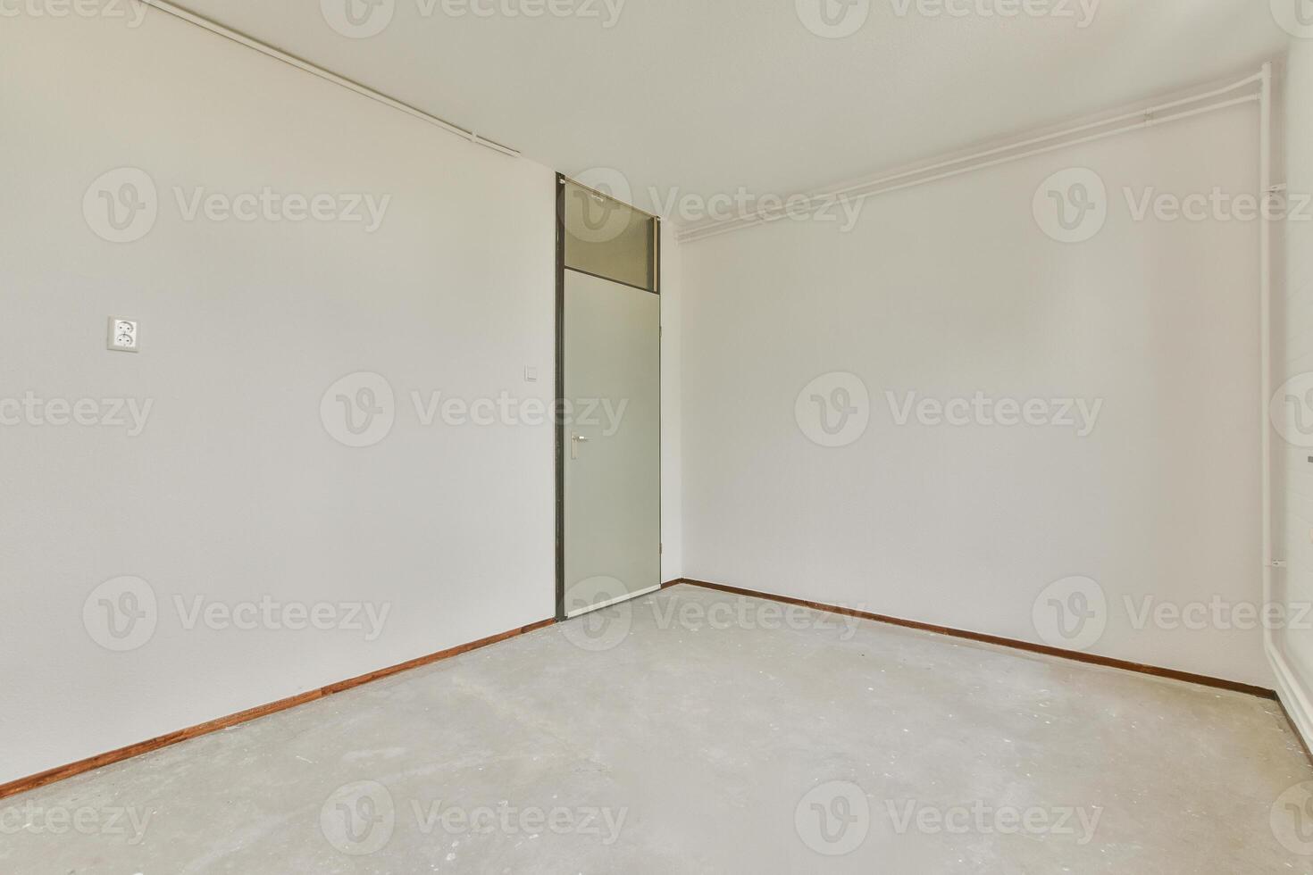 An empty room with a door and a window photo