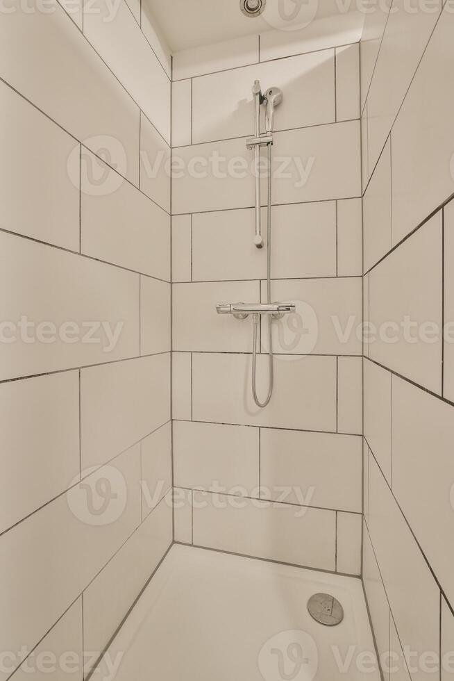 A shower with a shower head and a shower head photo