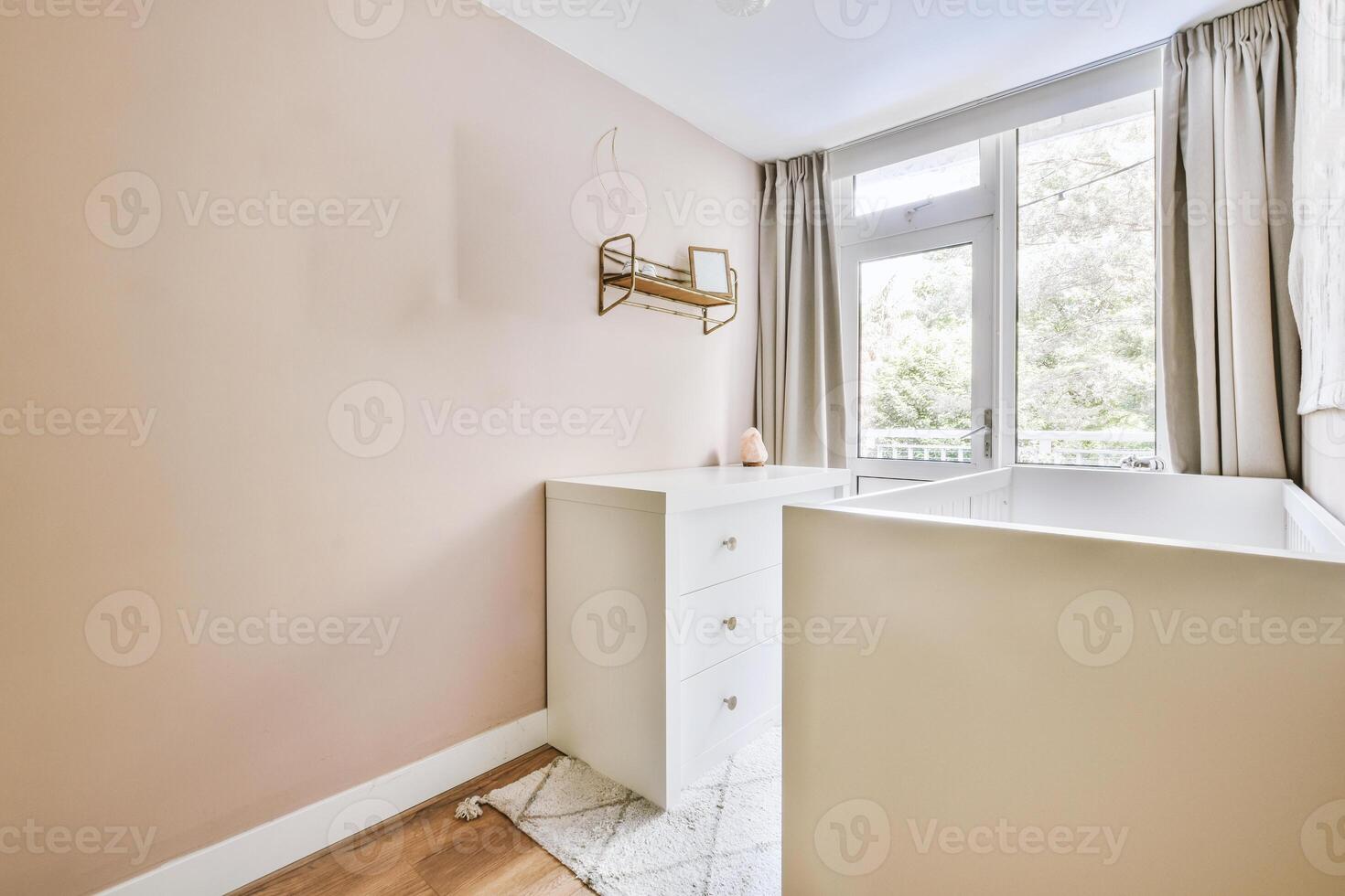 A small room with a white sink and a window photo