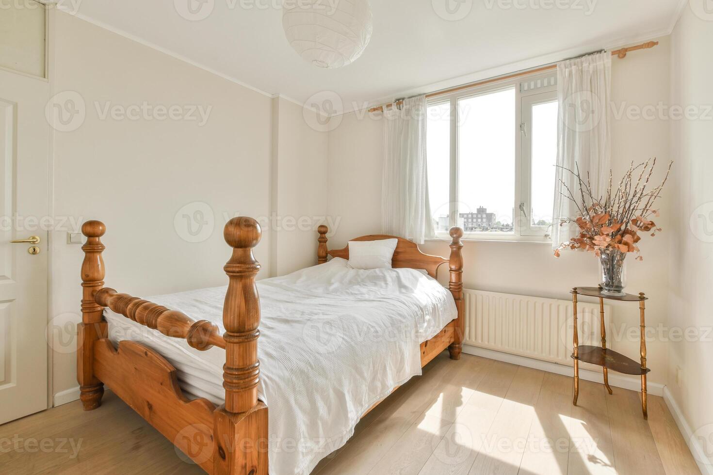 A wooden bed in a bedroom photo