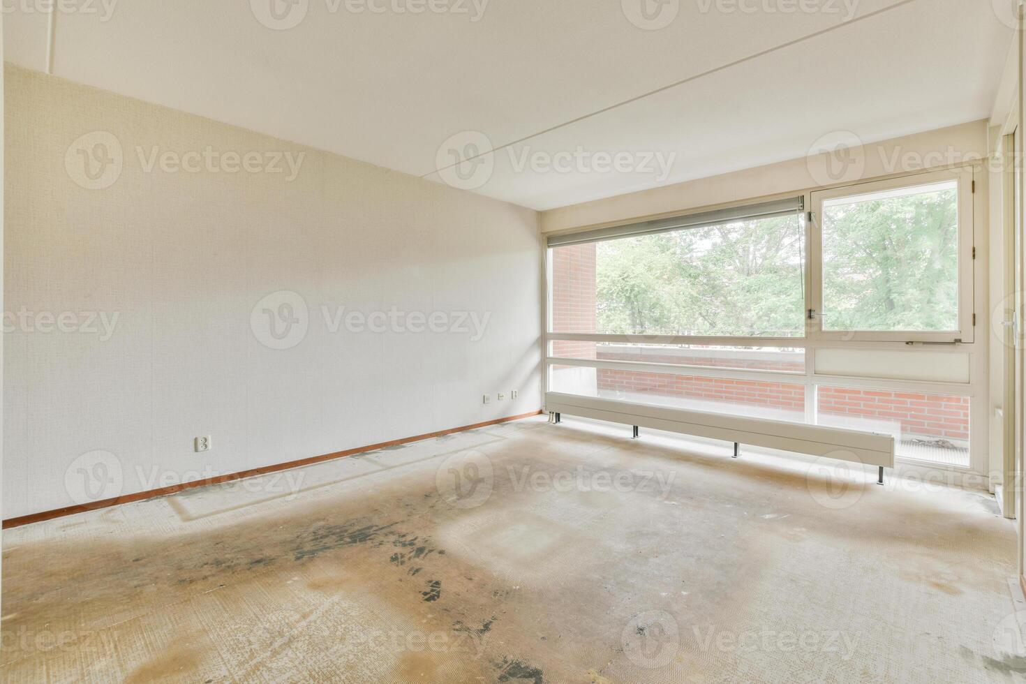A room with a window and a door photo
