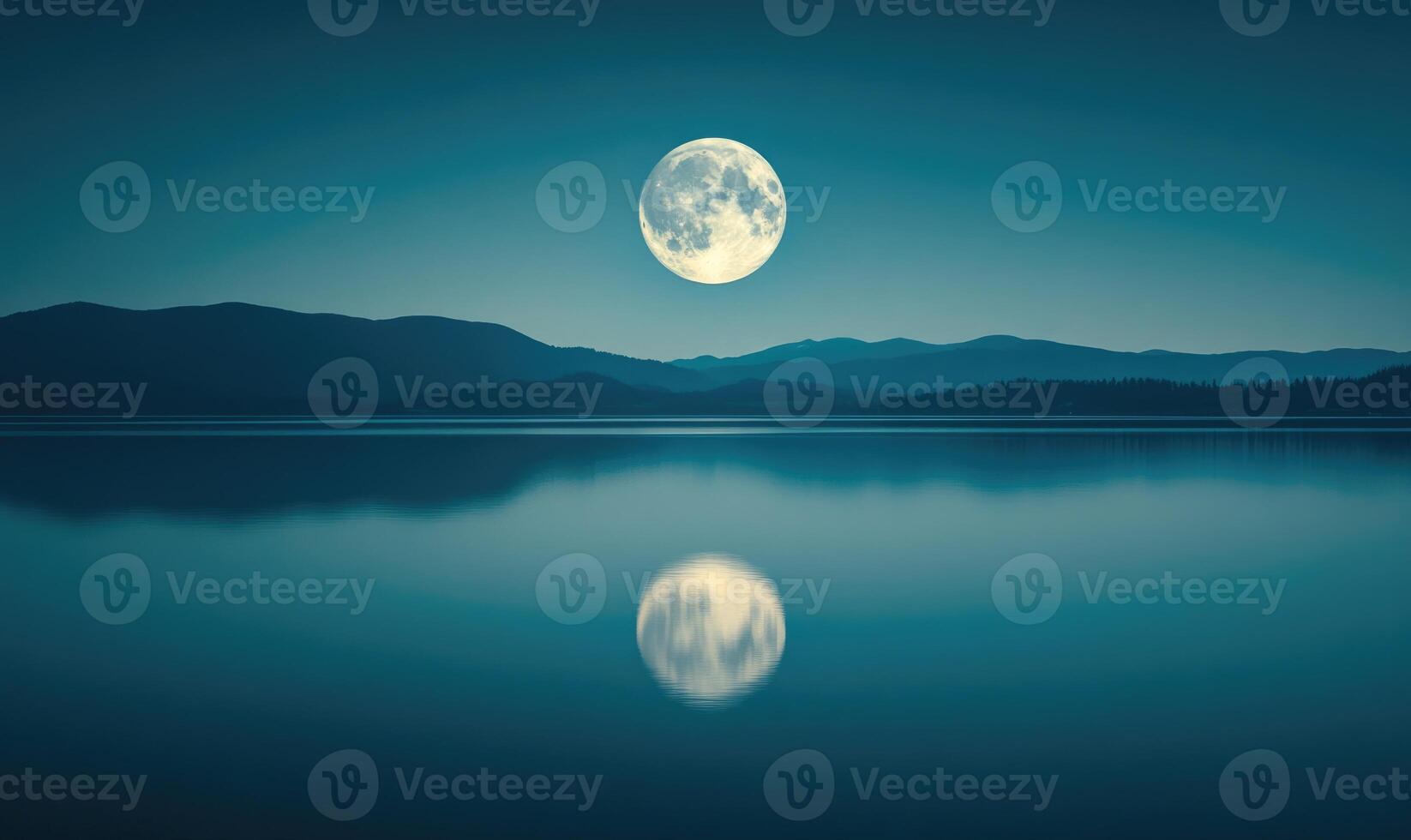Bright full moon reflected in a still lake, distant hills barely visible in the darkness photo