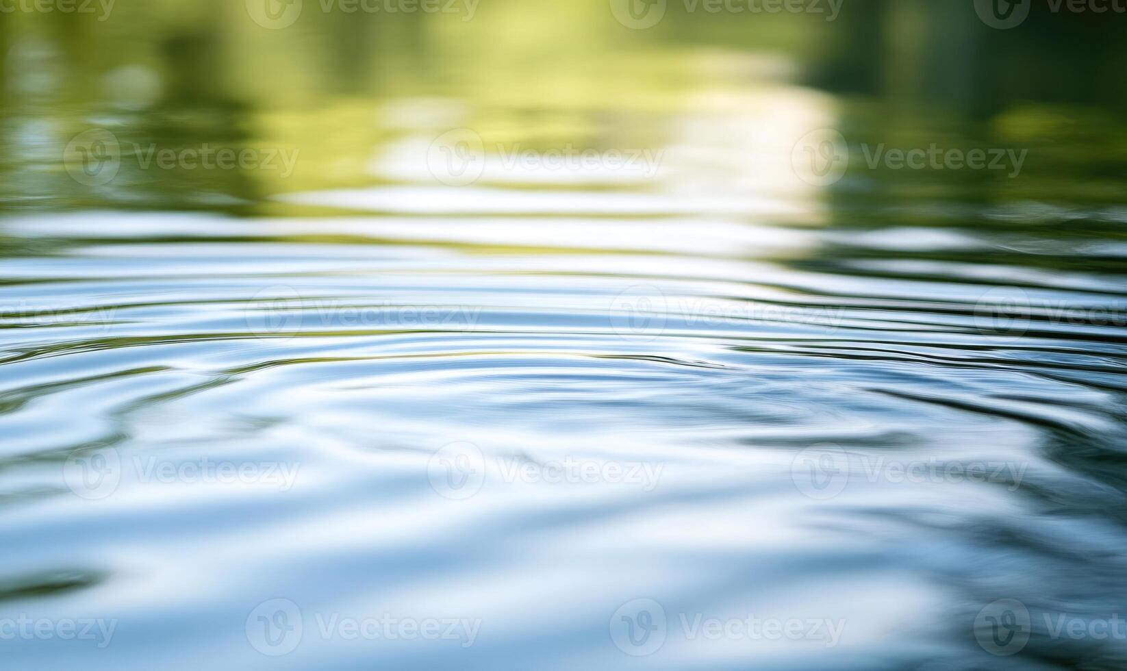 Close-up of ripples on a calm lake, sunlight glistening on the surface photo