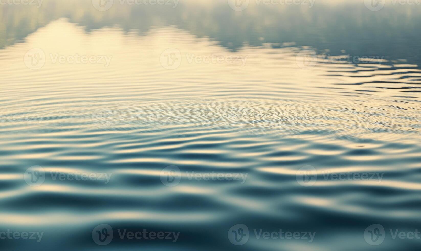 Calm lake surface with subtle waves, sunlight casting shimmering reflections photo