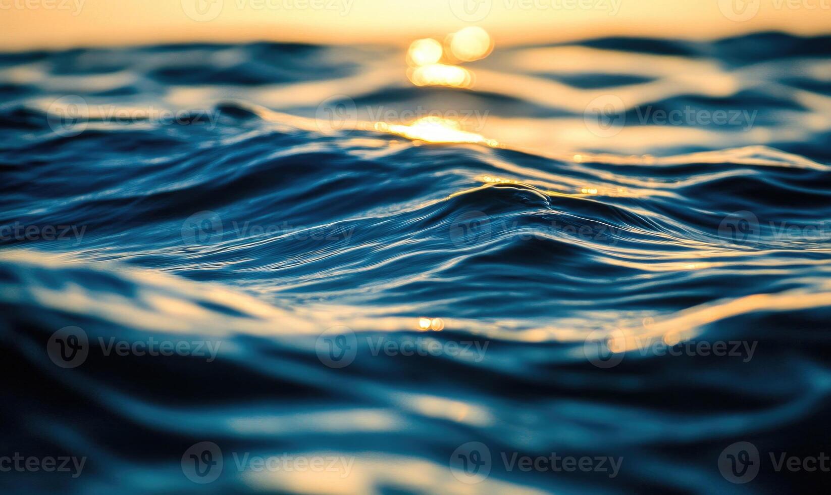 Close-up of small waves in a lake, sunlight sparkling on the water photo
