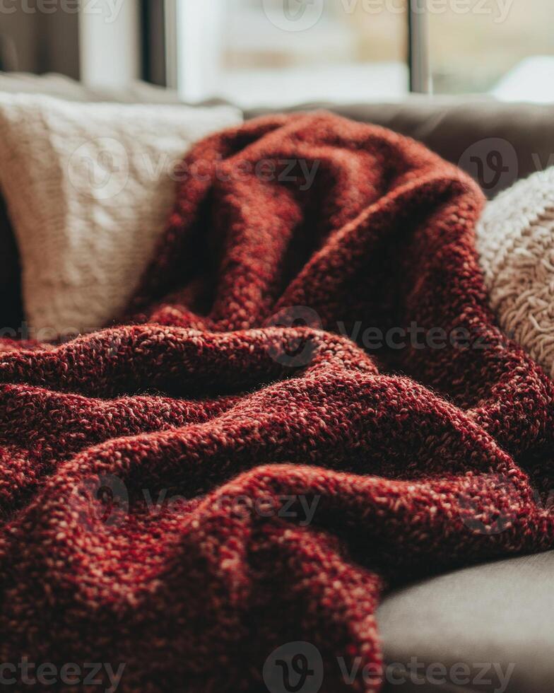 Chunky, textured blanket, autumn hues of deep red and brown photo
