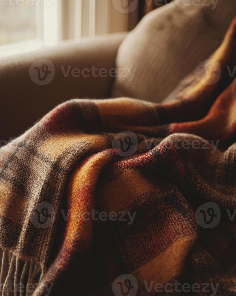 Cozy plaid blanket, autumn tones of brown and red photo