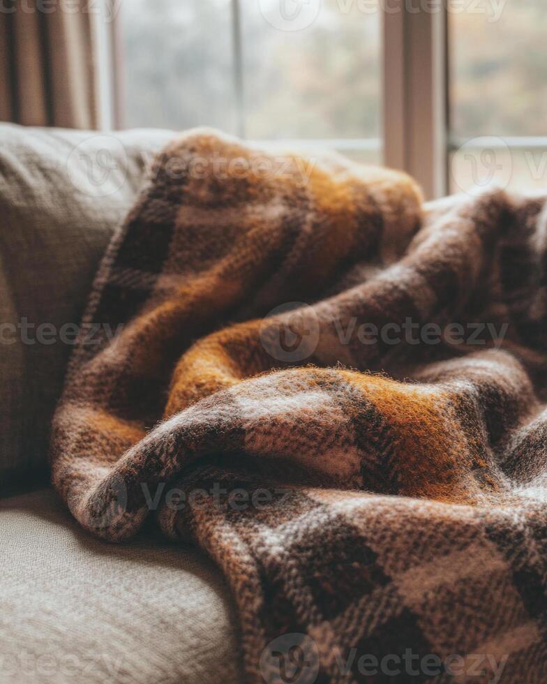 Cozy plaid blanket, autumn tones of brown and red photo