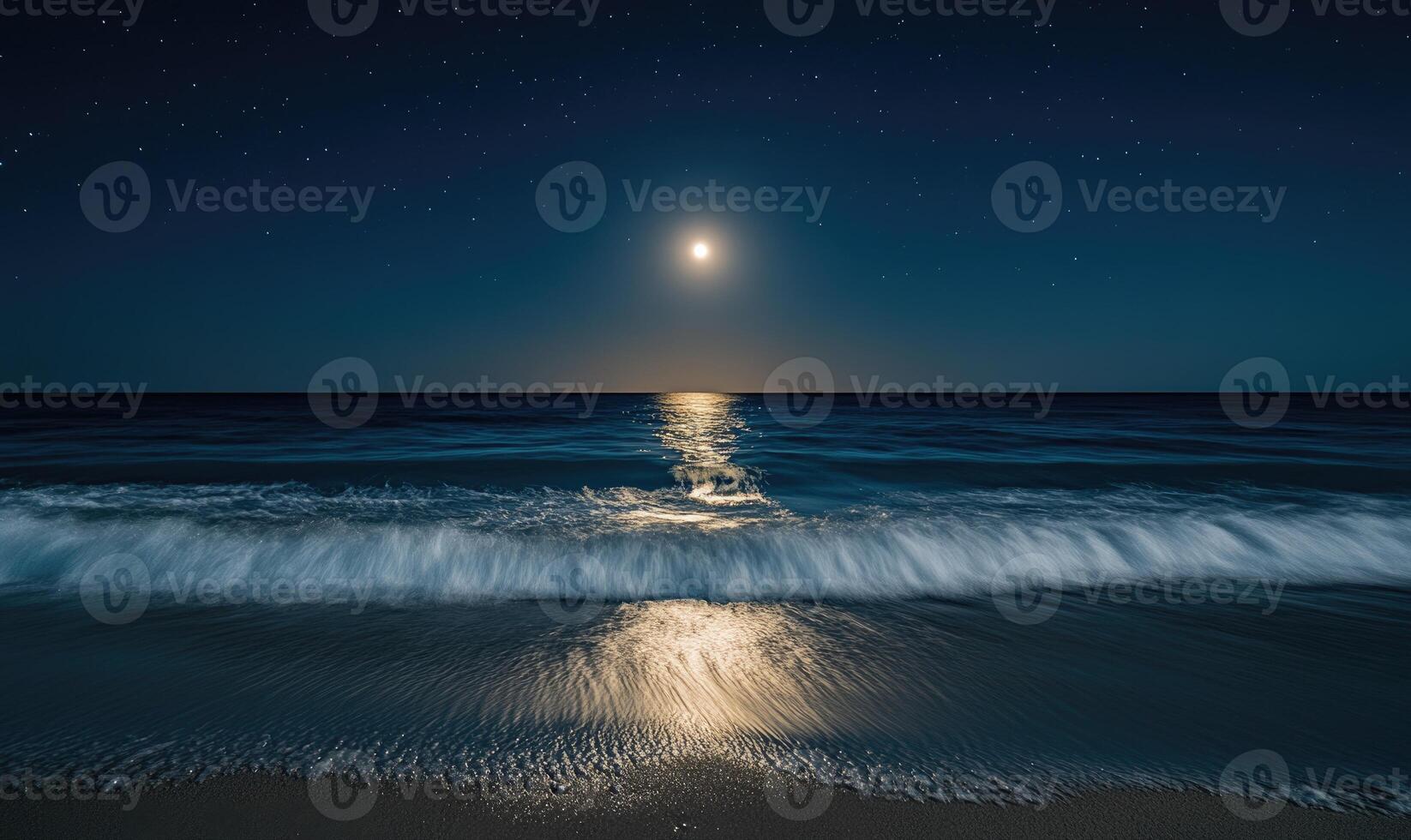 Bright moon casting a long reflection on the ocean photo