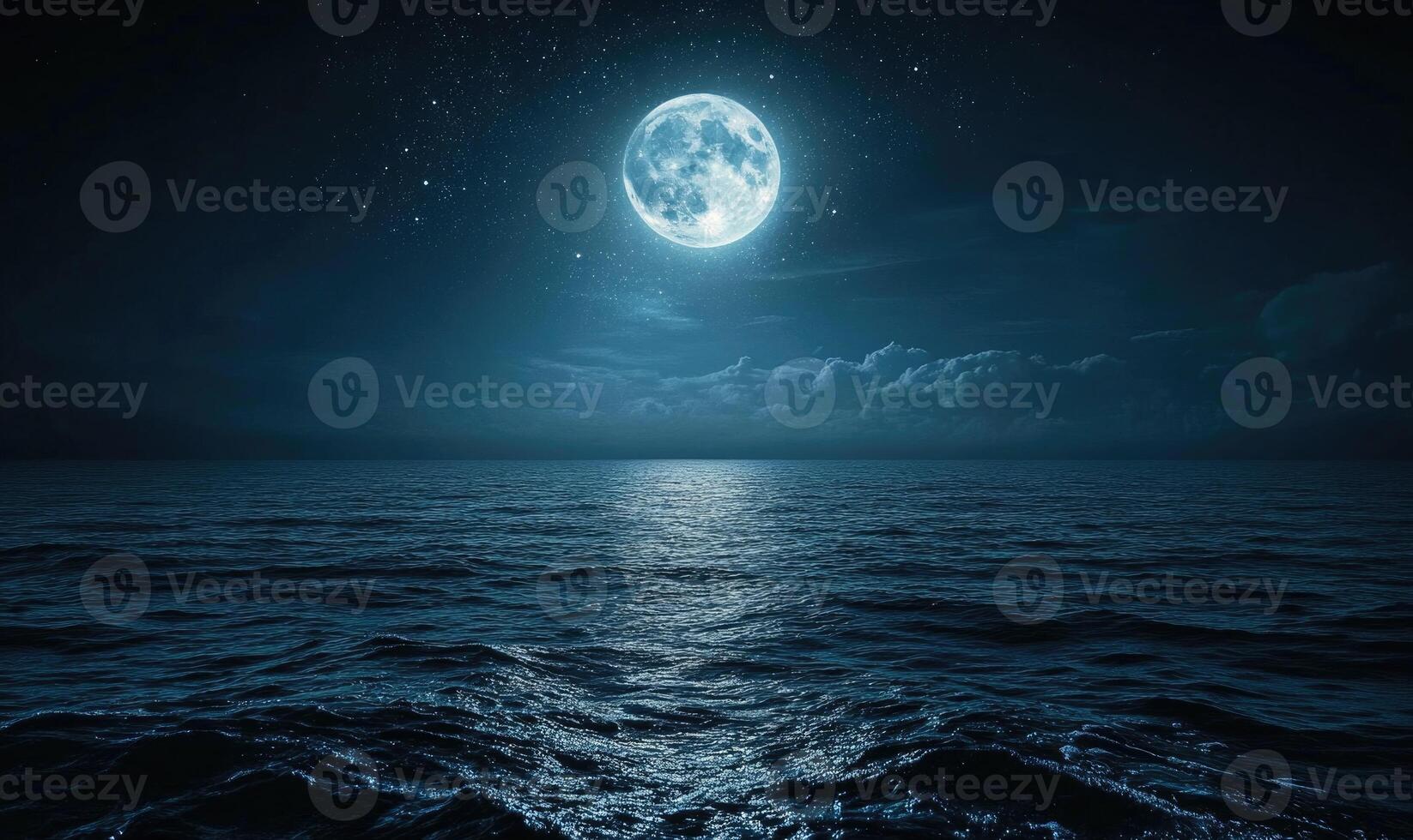 Bright moon casting a long reflection on the ocean photo