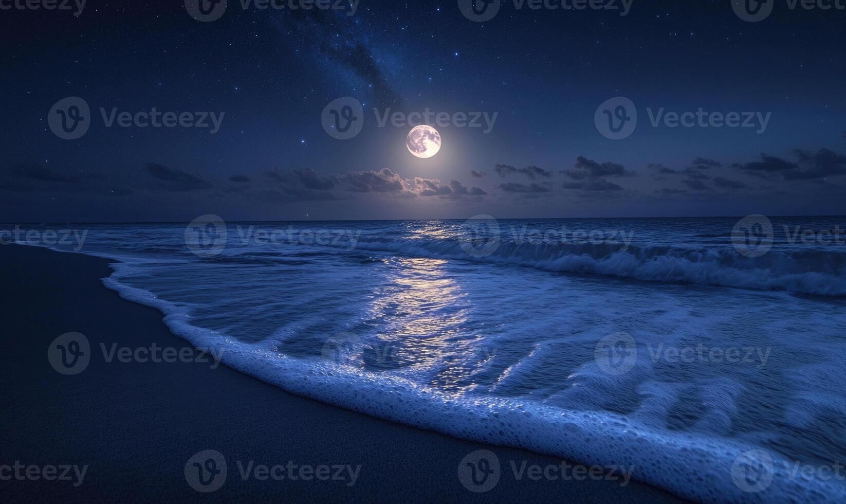 Bright moon casting a long reflection on the ocean photo
