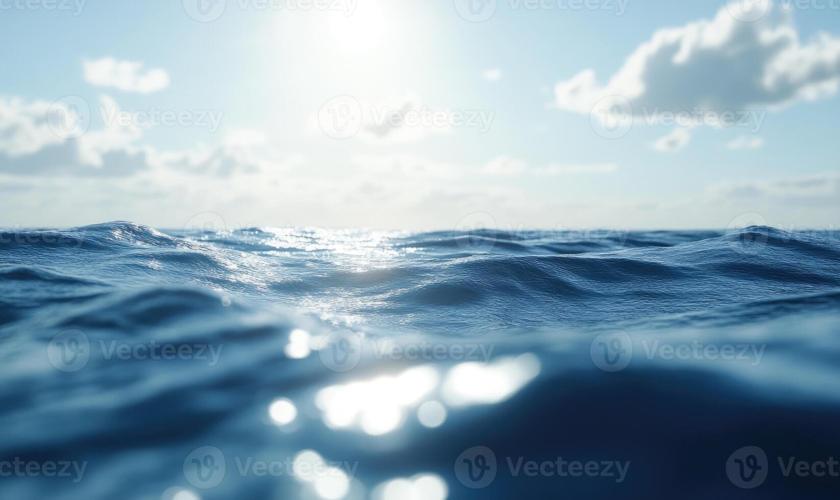 Ocean waves with a light breeze, sunlight glinting off the surface photo