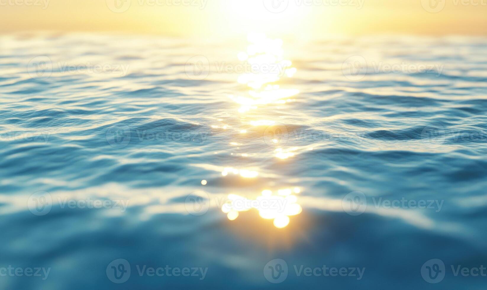 Ocean surface with gentle waves, sunlight sparkling on the water photo