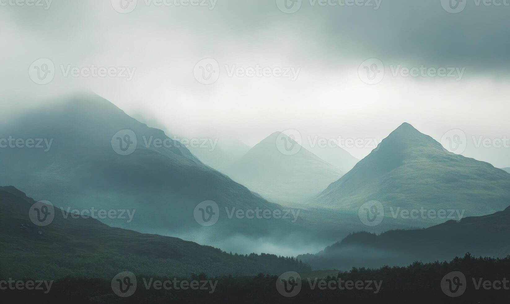 Overcast sky hanging low over a jagged mountain range photo