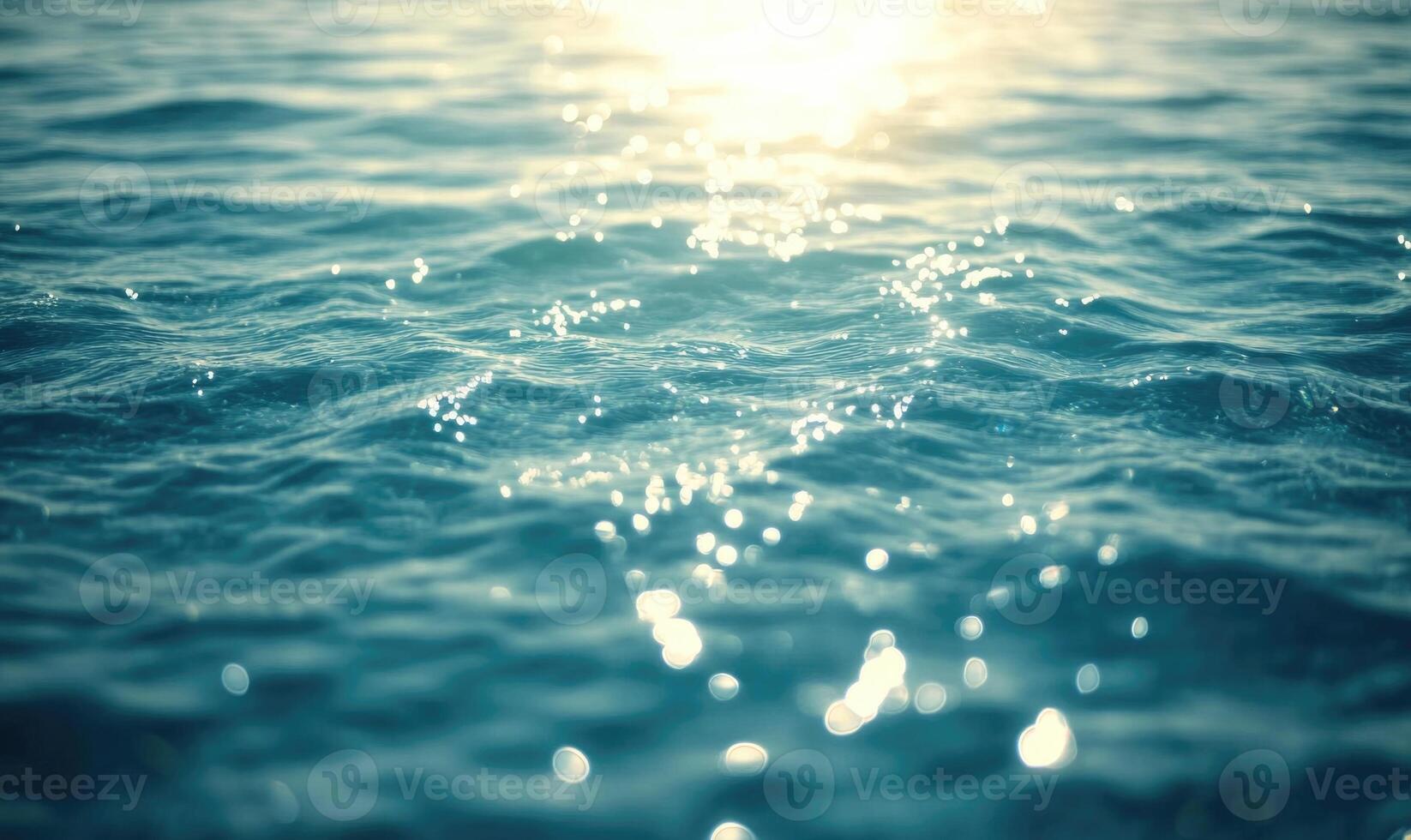 Ocean surface with gentle waves, sunlight sparkling on the water photo