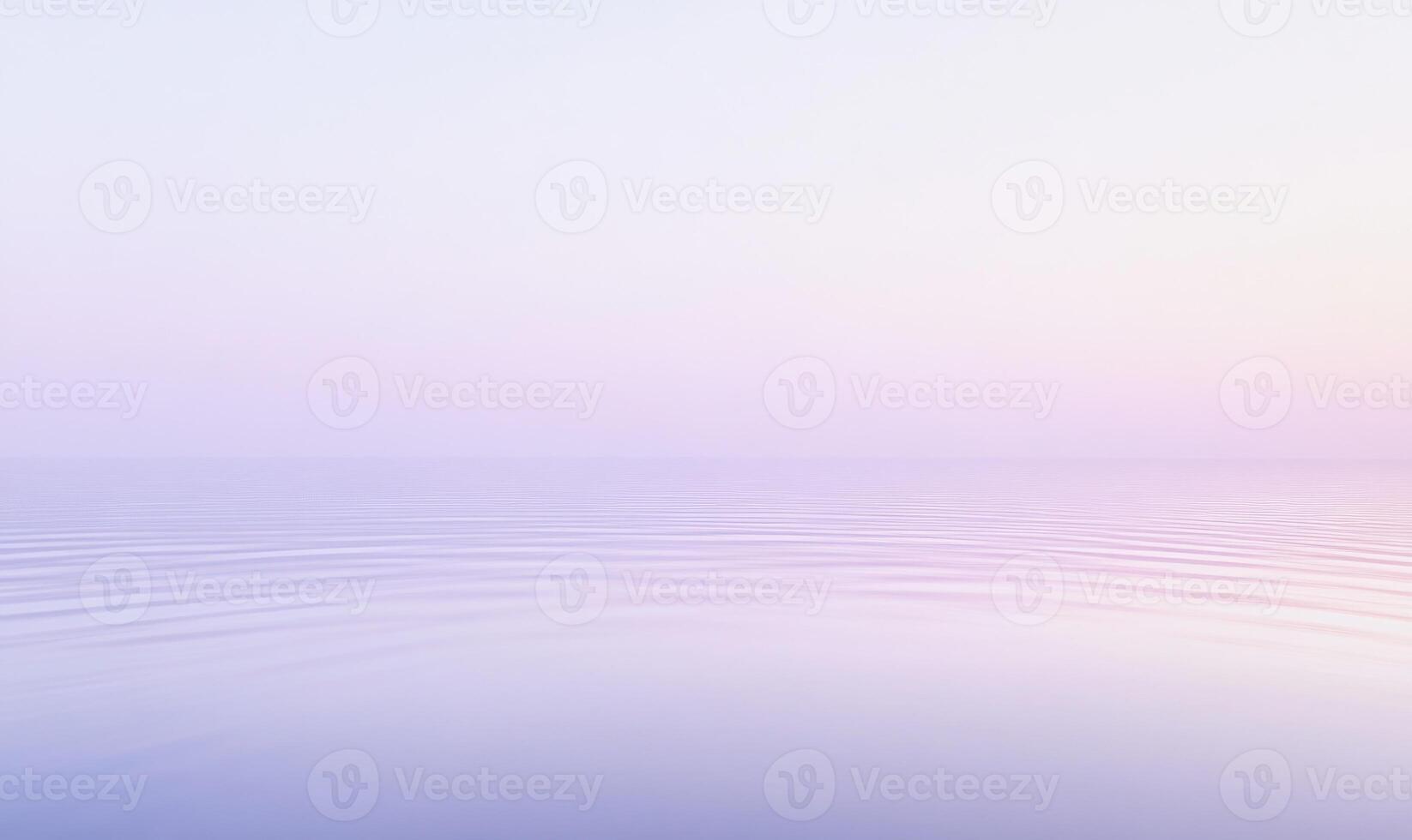 A calm, serene ocean with a light blue sky in the background photo