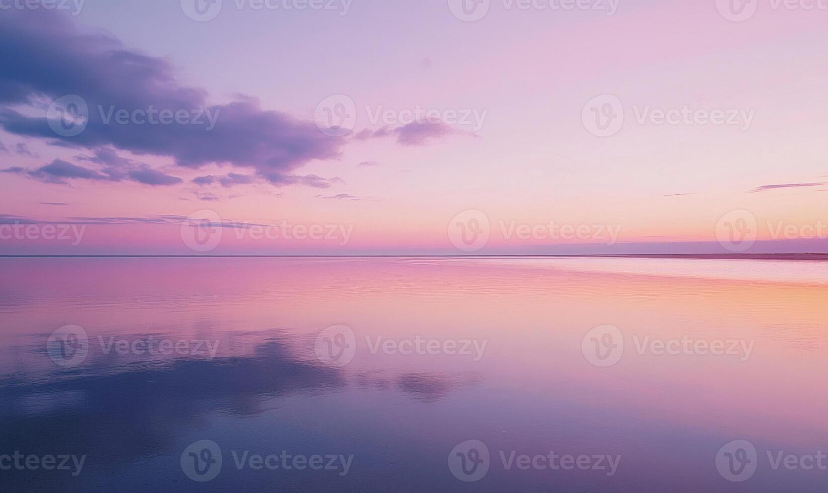 Soft purple and pink sunset, distant horizon blending with the colorful sky photo