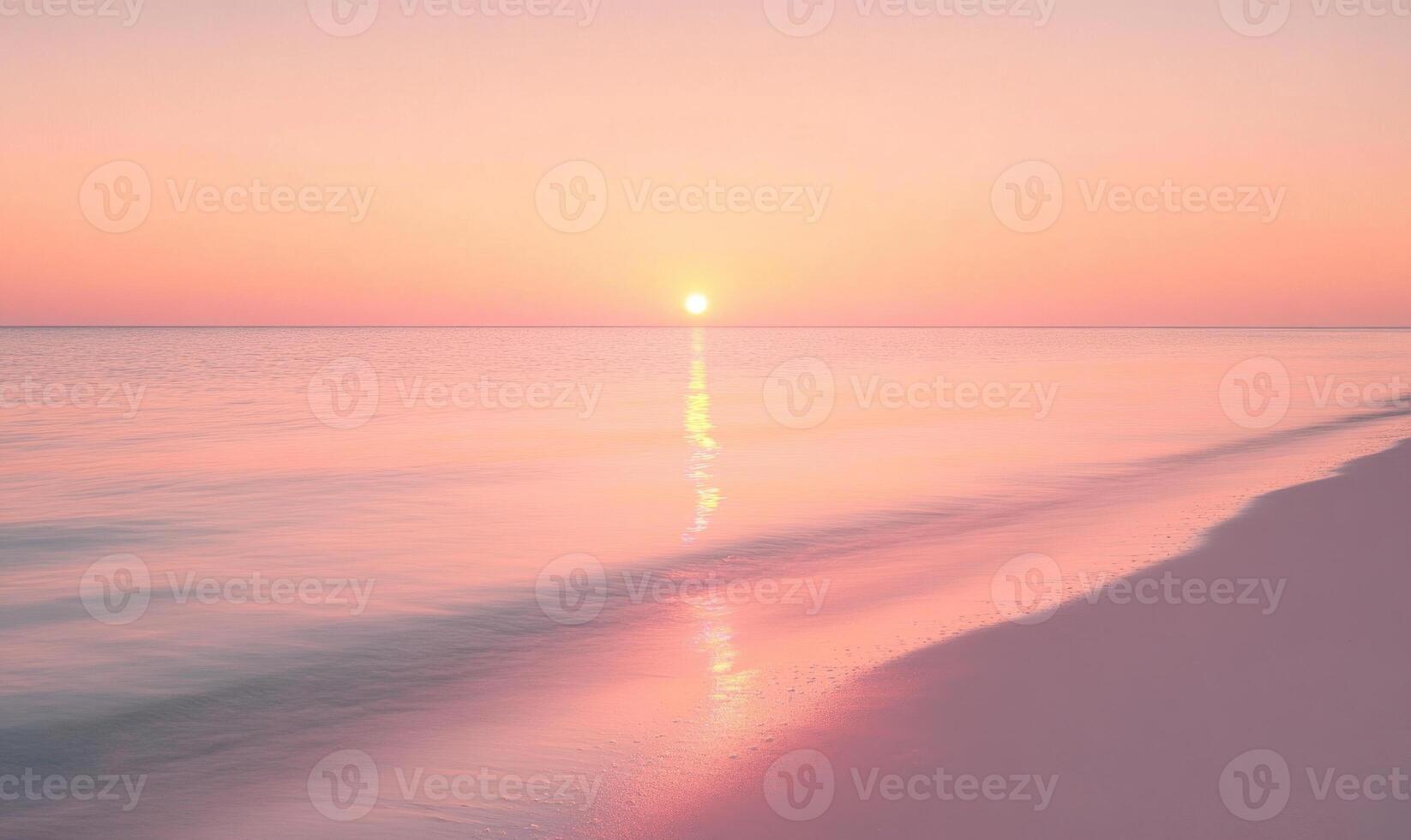 A beautiful beach with a pink and orange sunset in the background photo