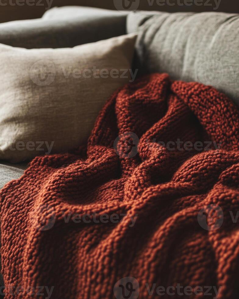 Warm, textured blanket, chunky knit, draped on a couch photo