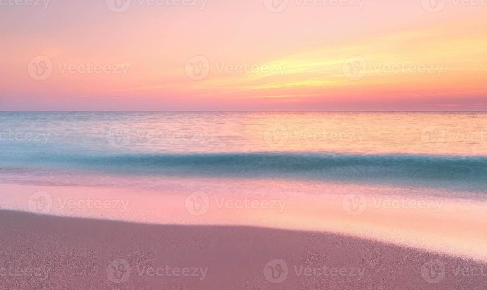 A beautiful beach with a pink and orange sunset in the background photo