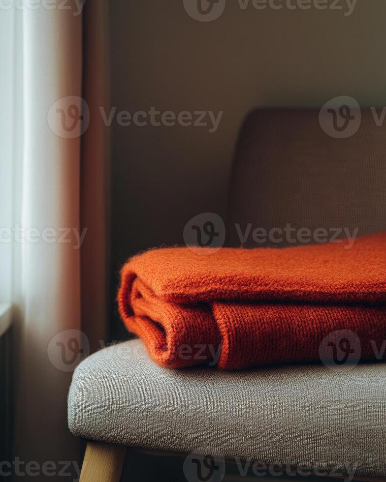 Warm, soft blanket, cozy autumn tones of red and orange photo