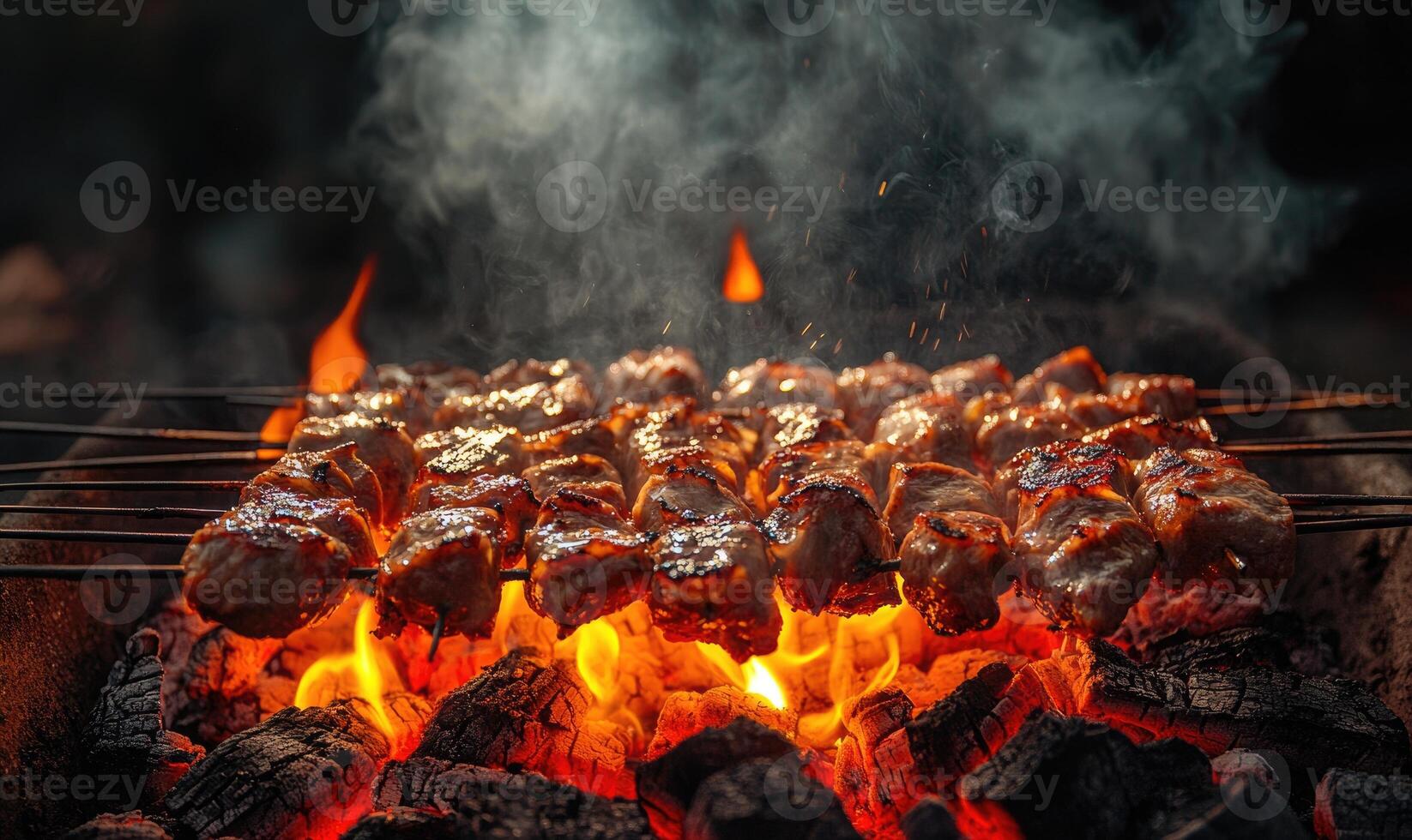 Skewers of mixed meat and vegetables on a grill photo