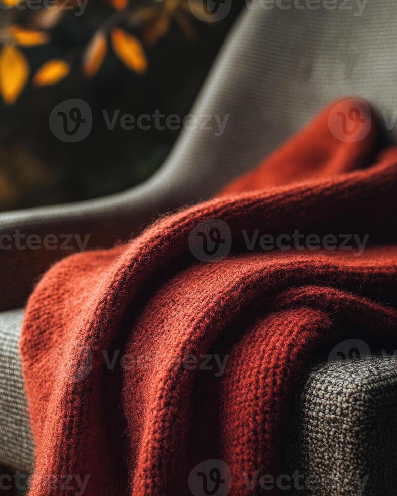 Warm, soft blanket, cozy autumn tones of red and orange photo