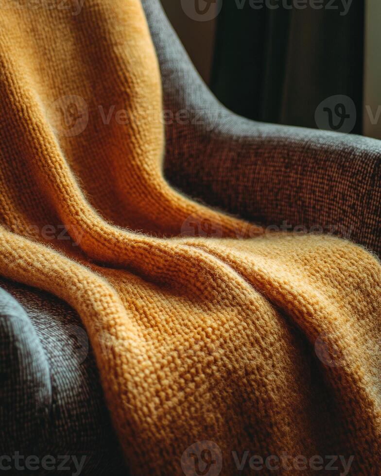Soft, warm blanket, thick and cozy, folded on a chair photo