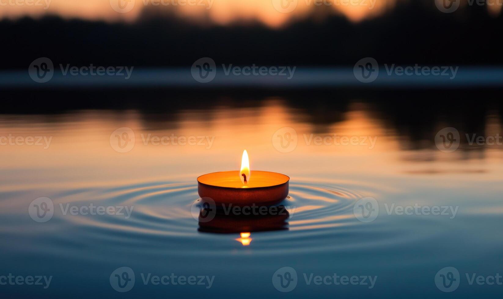 Single candle drifting softly on a calm lake, warm glow reflecting off the water photo