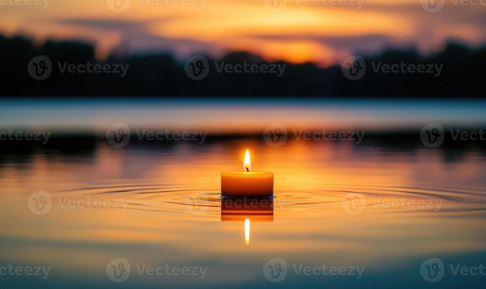 Single candle drifting softly on a calm lake, warm glow reflecting off the water photo