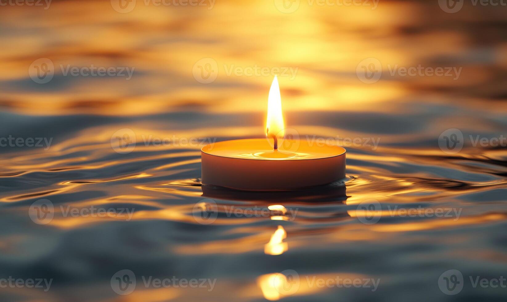 Single floating candle on rippling water, soft golden glow illuminating the scene photo