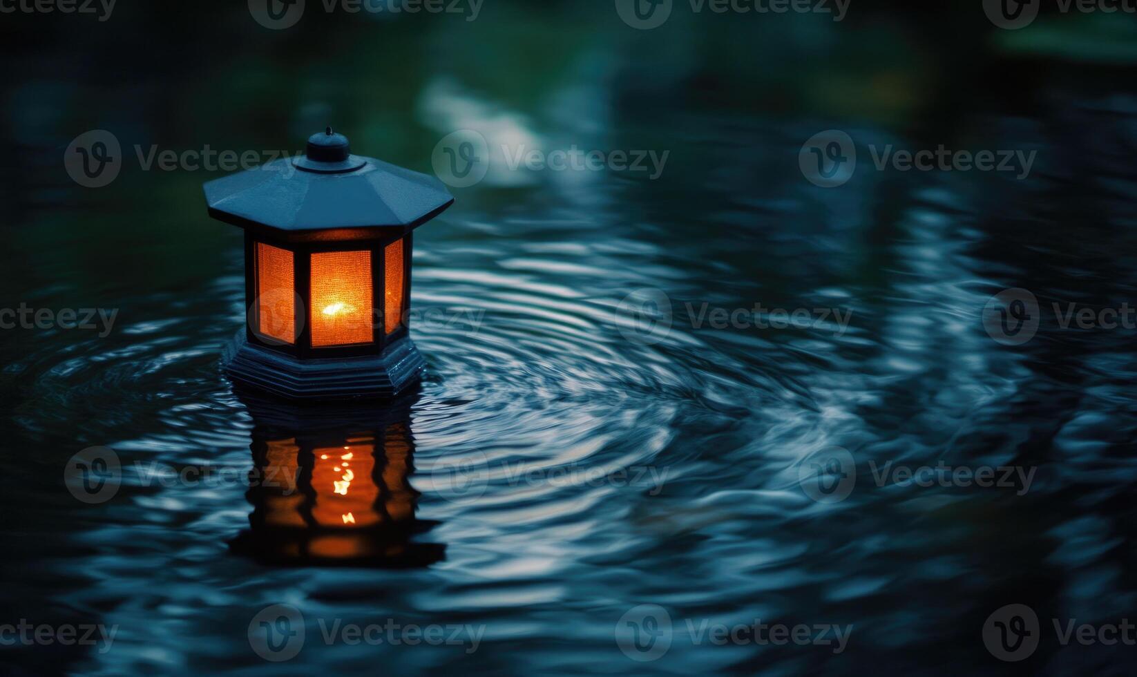 Single floating candle on rippling water, soft golden glow illuminating the scene photo