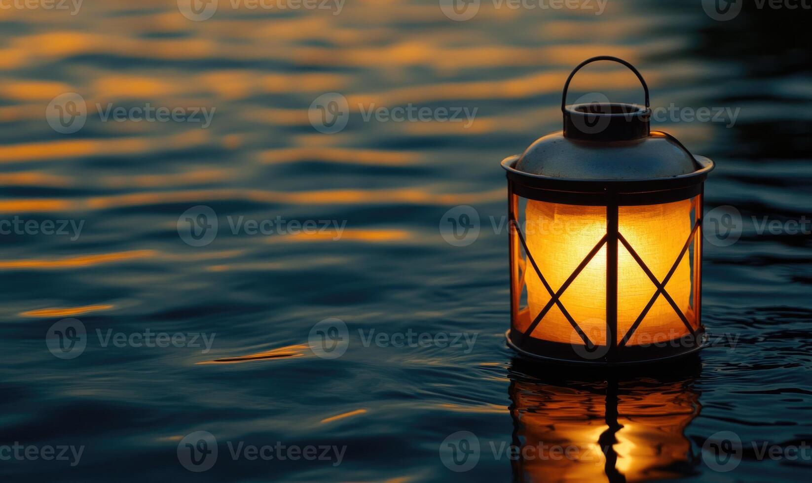 Single floating candle on rippling water, soft golden glow illuminating the scene photo